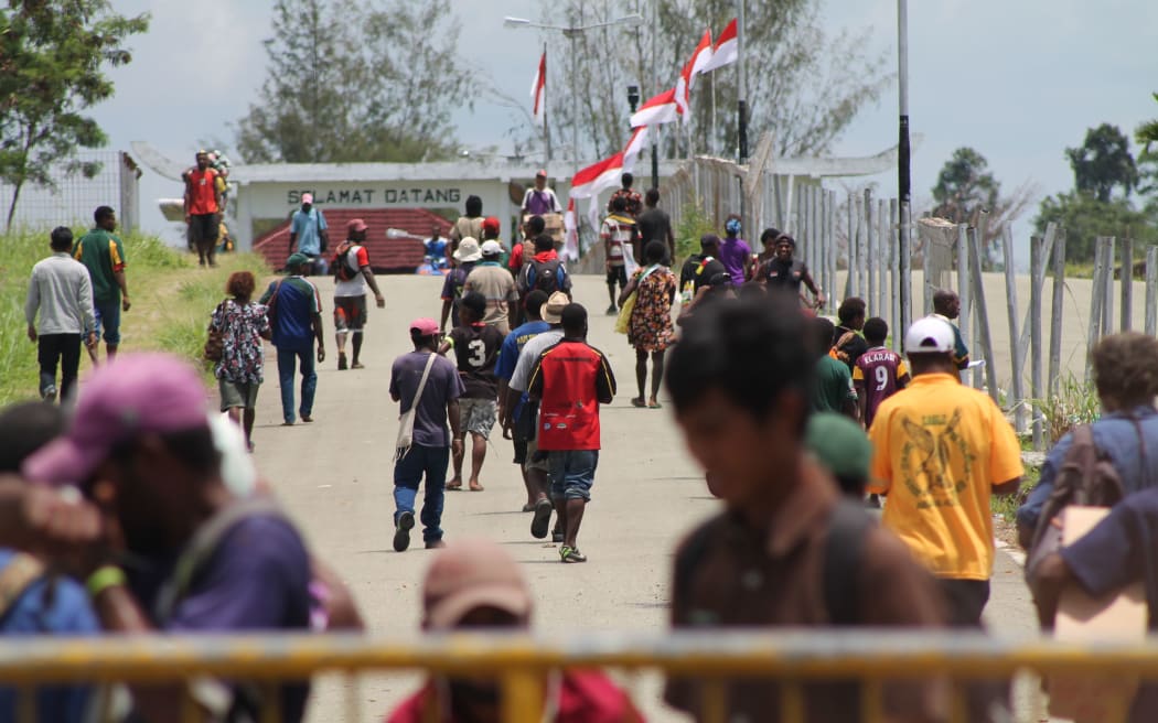People from Papua New Guinea make frequent trips across the Indonesia border at Wutung