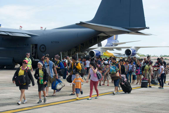 Typhoon Haiyan survivors evacuated by the RNZAF disembark in Cebu.