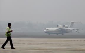 A Russian-made Beriev Be-200 amphibious firefighting aircraft, one of two rented by the Indonesian government to combat its forest and agricultural fires, taxis following its arrival