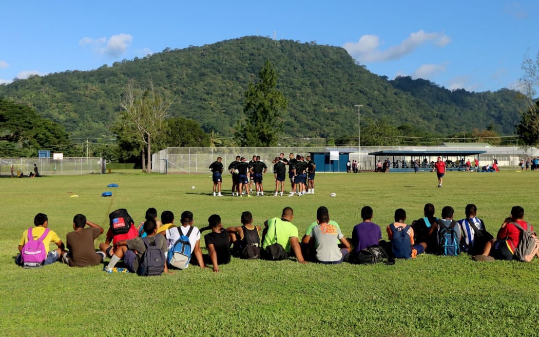 Kids watch on as the Queensland Reds train in Apia.