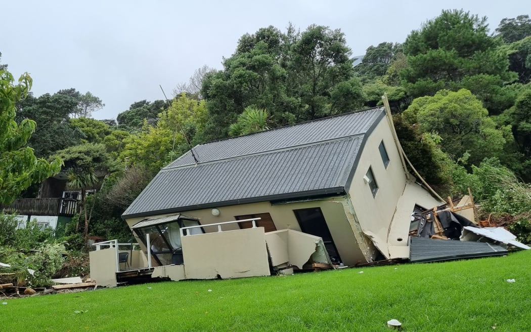 A house hit by a landslide in Muriwai