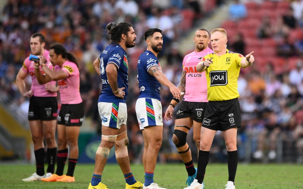 Shaun Johnson talks to the referee during the Warriors game against Penrith