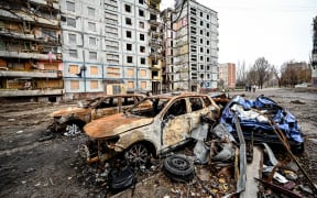 Crashed cars are left outside an apartment building destroyed in the shelling of Russian troops, Zaporizhzhia, southeastern Ukraine.