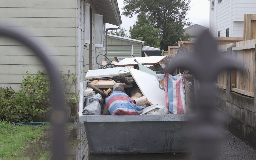 Some Māngere streets' skip bins are full of discarded items after flooding in Auckland.
