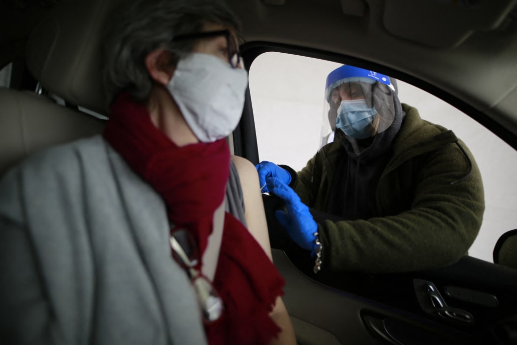 Huston resident, Rosemary receives her second Moderna vaccination at a drive-through facility near Houston, Texas