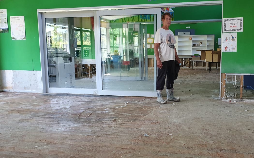 School principal Simon Couling, in a classroom after they were hosed out by firefighters following flooding in Tinui, near the Wairarapa coast, during Cyclone Gabrielle.