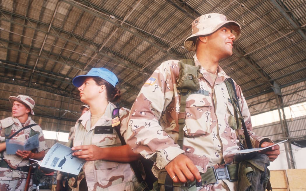 358923 05: U.S. soldiers get redeployment documents January 23, 1994 as they withdraw from Mogadishu, Somalia.