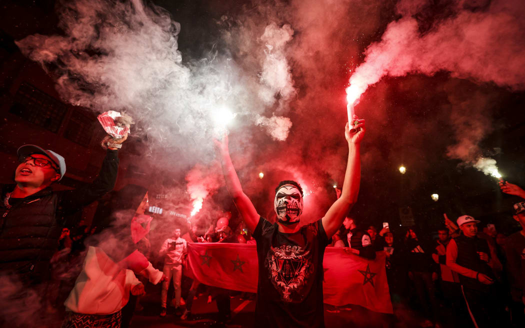 Moroccans celebrate after their team won the Qatar 2022 World Cup round 16 football match against Spain.