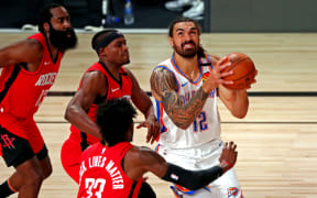 LAKE BUENA VISTA, FLORIDA - AUGUST 20: Steven Adams #12 of the Oklahoma City Thunder shoots the ball against Robert Covington #33 of the Houston Rockets during the first quarter in game two in the first round of the 2020 NBA Playoffs on August 20, 2020 in Lake Buena Vista, Florida.