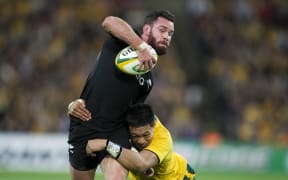 Ryan Crotty is tackled by Australia's Israel Folau in 2013.