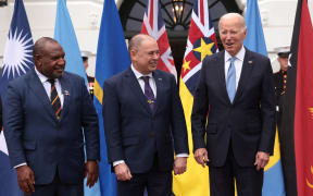 WASHINGTON, DC - SEPTEMBER 25: U.S. President Joe Biden (R) stands with Prime Minister of the Cook Islands Mark Brown (C) and Prime Minister of Papua New Guinea James Marapeand as they participate in a group photo with other leaders at the Pacific Islands Forum (PIF) as part of the U.S.-Pacific Islands Forum Summit at the White House on September 25, 2023 in Washington, DC. President Biden and senior administration officials are meeting with Pacific Islands leaders to discuss regional corporation on climate change, economic growth and regional security.   Win McNamee/Getty Images/AFP (Photo by WIN MCNAMEE / GETTY IMAGES NORTH AMERICA / Getty Images via AFP)