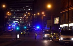 Ambulances arrive at the scene at Manchester Arena following blasts at an Ariana Grande concert.