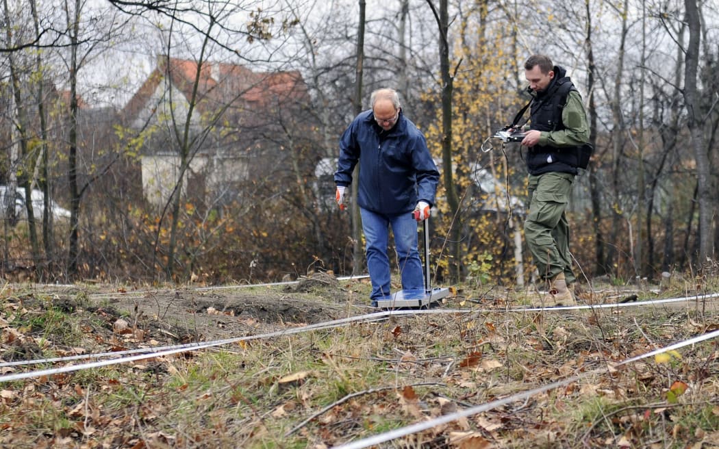 Experts use ground-penetrating radar to inspect an area where a World War II Nazi train is supposed to be hidden in Walbrzych, Poland