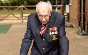WWII veteran Captain Tom Moore, 99, walking in his garden in Marston Moretaine, Bedfordshire, to raise money for Britain's National Health Service (NHS).