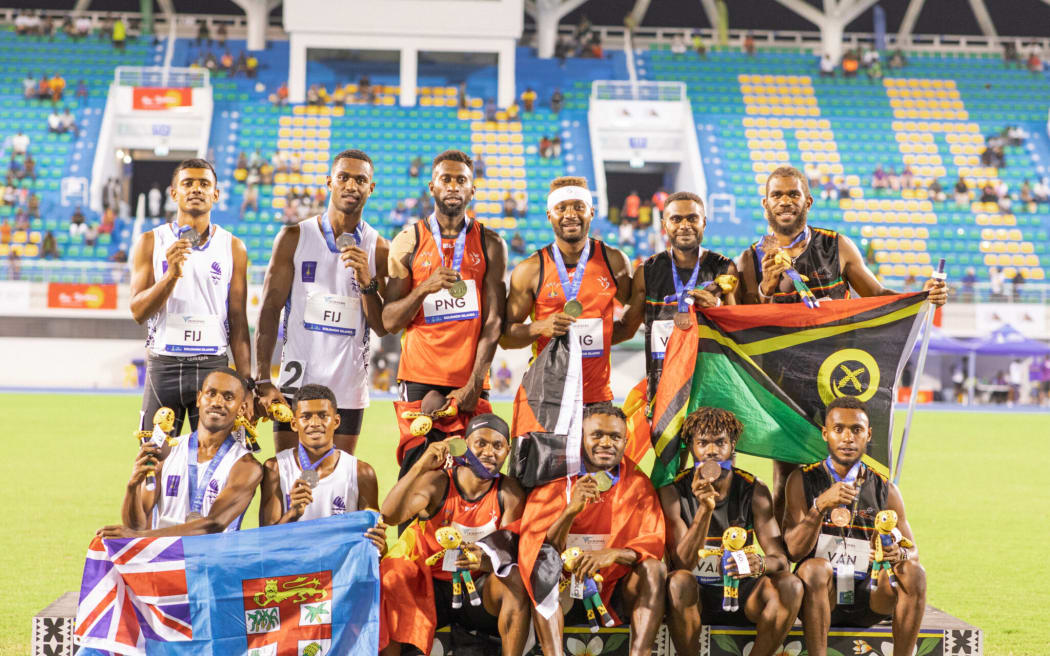 The 4x400m men's relay medal winners; PNG, Fiji, Vanuatu.