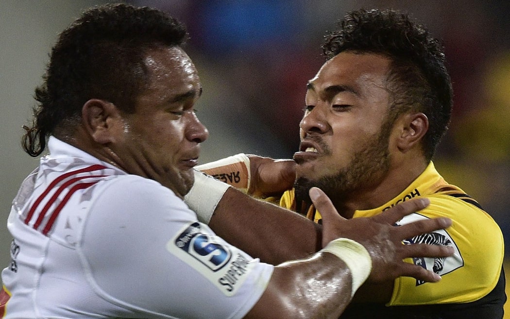 Hurricanes' Willis Halaholo (R fends off Chiefs' Siate Tokolahi during the Hurricanes vs Chiefs Super Rugby match. 2016.