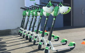 Rack 'em up: Lime scooters for hire outside the TraffiNZ conference in wellington this week - as part of a charm offensive in the capital.