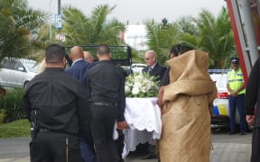 Jonah Lomu's casket is carried out of the Vodafone Events Centre in Manukau where friends and family gathered for a traditional service.
