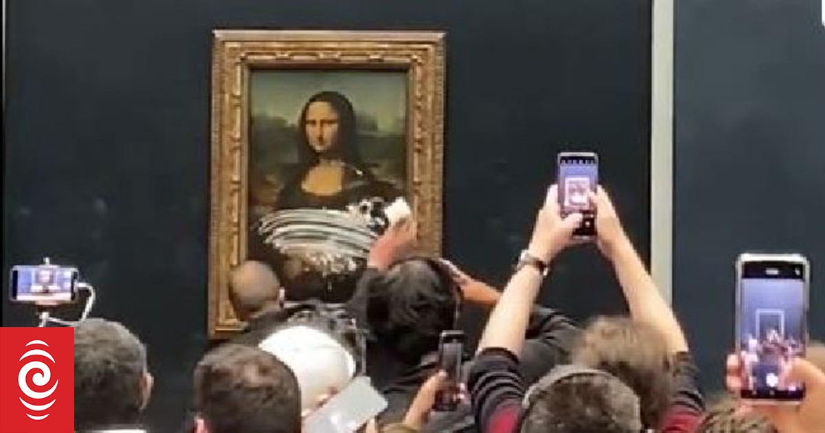 Mona Lisa Man dressed as old woman throws cake at da Vinci painting
