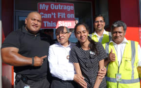 Bhaskar Desai (second from left) and some of his supporters at the protest against Kiwibank removing its services from his shop.