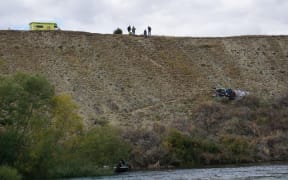 Emergency services look over the scene of a fatal jet boat crash on the Clutha River below Wanaka Airport 24 February 2019.