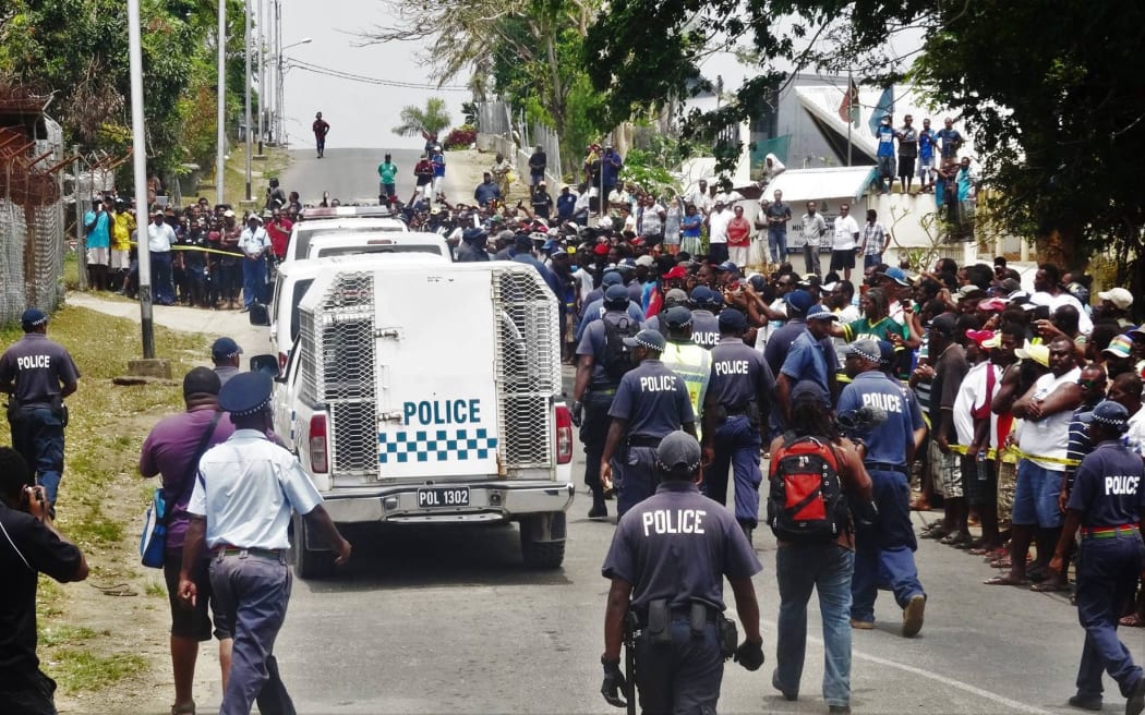 Crowds gather to witness the convicted MP's inside the escorted Police Vehicle in front of the Correctional facility that they will serve their jail term