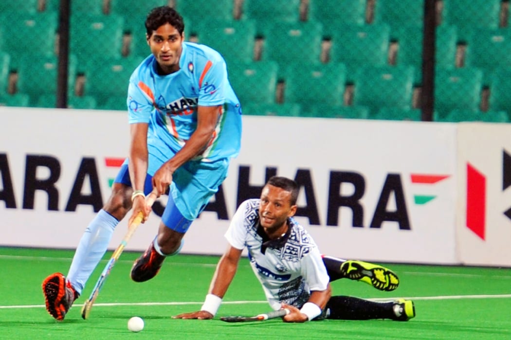 Fiji men's captain Hector Smith Junior puts his body on the line against India during the World League Round 2 match in New Delhi in 2013.