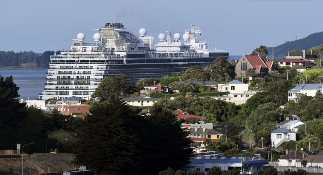 Cruise ship 'Majestic Princess' looms behind the houses of Port Chalmers as it leaves Dunedin on 4 November 2022.