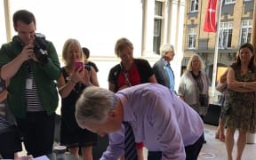 Auckland Mayor Phil Goff signing the Auckland Art Gallery Scroll