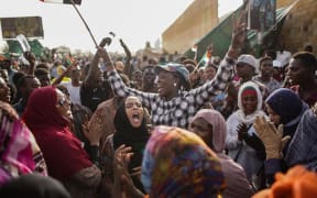 11 April 2019, Sudan, Khartoum: Sudanese demonstrators celebrate the arrest of long-time President Omar al-Bashir by the armed forces,
