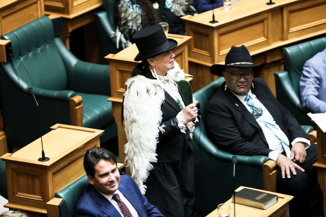 Maori Party MP Debbie Ngarewa Packer walks towards the clerk to take the affirmation which will allow her to sit and vote in the House