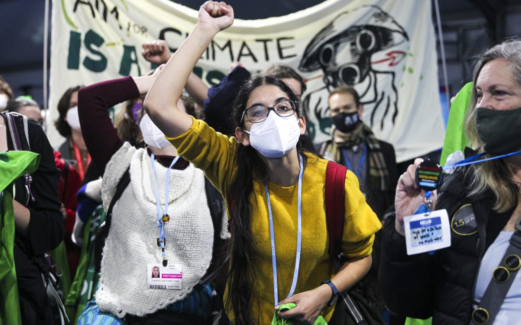 Climate activists and delegates stage a walk out in protest of the ongoing negotiations yesterday.