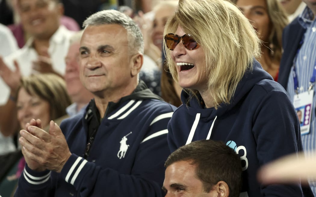 The parents of Serbia's Novak Djokovic, father Srdjan Djokovic (L) and mother Dijana Djokovic, react after he beats Russia's Andrey Rublev in the men's singles quarter-final match on day ten of the Australian Open tennis tournament in Melbourne on January 25, 2023. (Photo by DAVID GRAY / AFP) / -- IMAGE RESTRICTED TO EDITORIAL USE - STRICTLY NO COMMERCIAL USE --