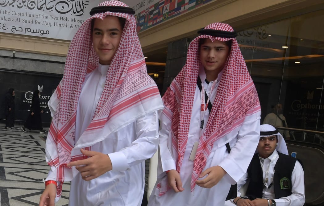 Amir Mohamed Khan (R), 14, and Chouaib Milne, 16, are pictured at a hotel in Mecca on August 7, 2019, prior to the start of the annual Hajj pilgrimage  - Two hundred survivors and relatives of victims of March's massacres at two mosques in Christchurch,  are undertaking the hajj pilgrimage