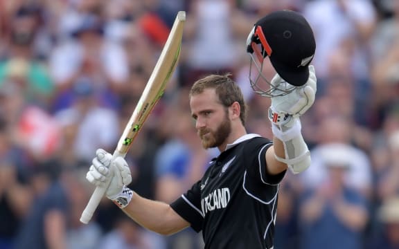 New Zealand's captain Kane Williamson celebrates after scoring a century during the 2019 Cricket World Cup group stage match between West Indies and New Zealand at Old Trafford in Manchester.