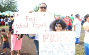 Valerie Adams and her 7-year-old daughter demonstrating support for a "Free West Papua" to coincide with a visit to Pago Pago by the Indonesian Ambassador to the US.