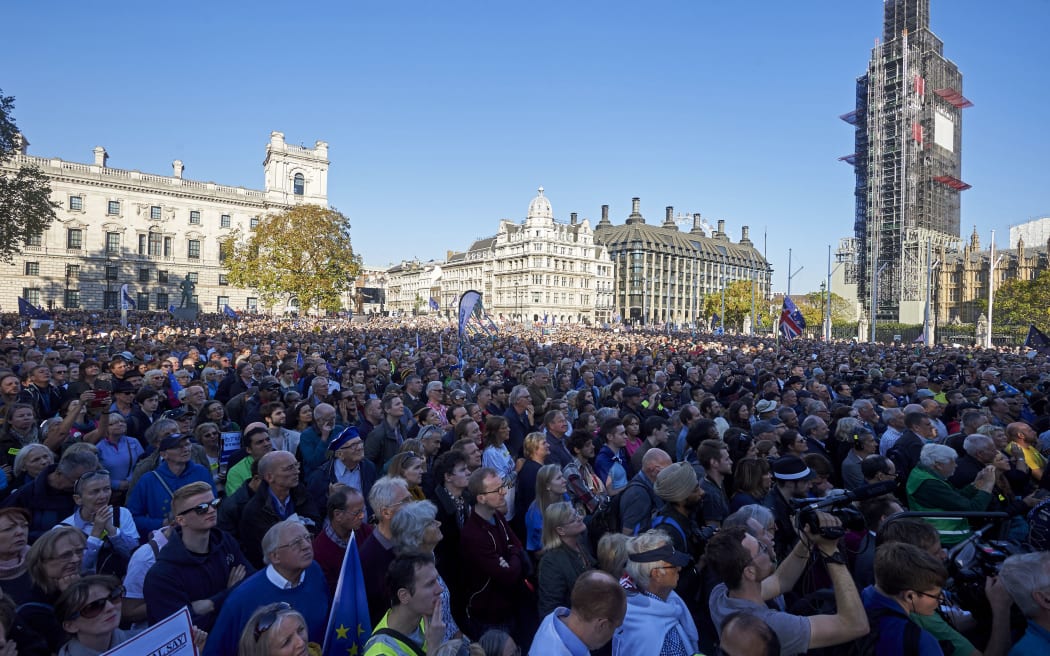 Demonstrators listen to speeches in Parliament Square after taking part in a march calling for a People's Vote on the final Brexit deal in central London.