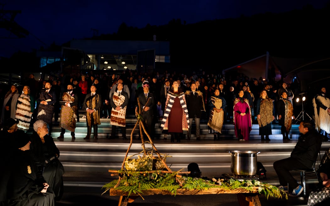 Female tohunga reciting karakia to one of the nine stars in the Matariki cluster.