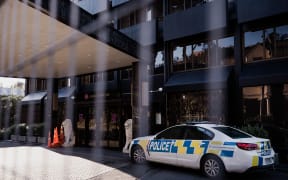 Police at the Grand Mecure Hotel in Wellington, which is being used as a managed isolation facility.