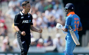 Trent Boult dismisses India's Hardik Pandya to pick up his 5th wicket during the 4th One Day International cricket match.