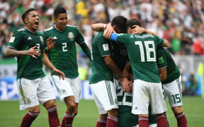 Hirving Lozano (covered) of Mexico celebrates his 0-1 goal with team mates.