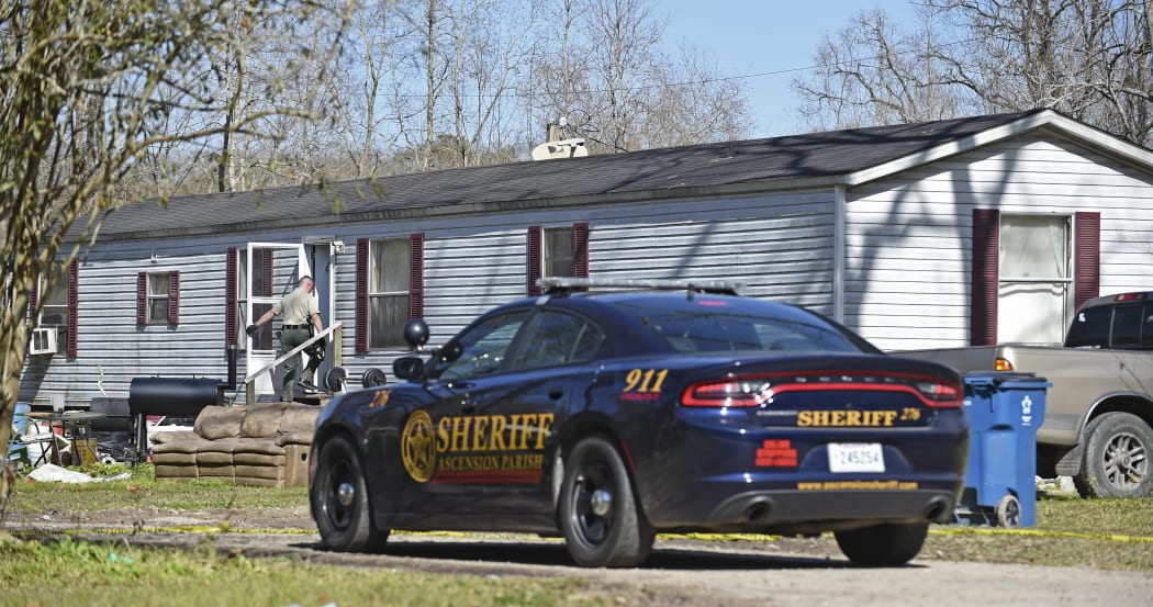 Investigators work the scene of a shooting on Saturday, Jan. 26, 2019, in Ascension Parish in Louisiana.  Authorities in Louisiana say a shooting has left five people dead in two parishes. AP)