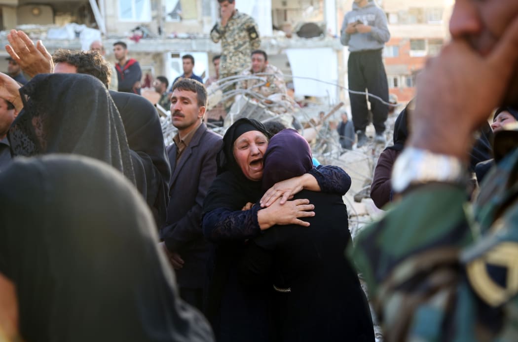 Survivors in shock amid the destruction in Sarpol-e Zahab province, Kermanshah, Iran.