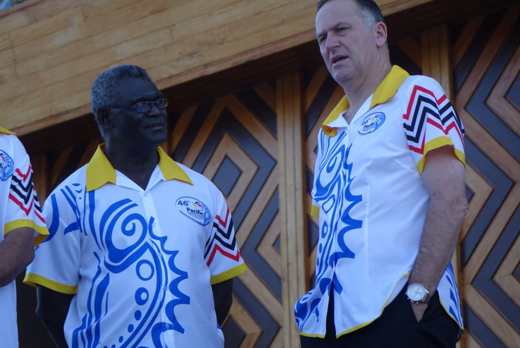 Solomon Islands prime minister Manasseh Sogavare talks to his New Zealand counterpart John Key at the 205 Pacific Forum summit in Port Moresby.