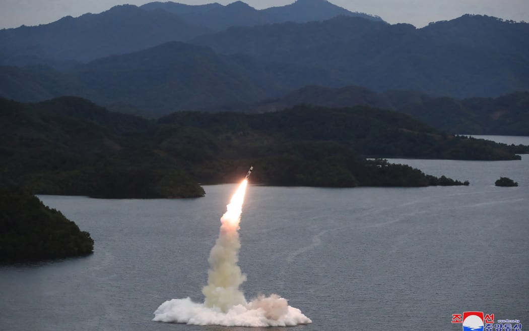 This undated photo released by North Korea's official Korean Central News Agency (KCNA) on October 10, 2022 shows a missile launch test in Hokkaido by the Korean People's Army Tactical Nuclear Operations Unit at an undisclosed location. is showing.