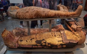 Mummies and sarcophagus in the British Museum in London.