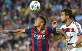 The Barcelona striker Neymar fights for the ball.
