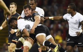 Wales captain Sam Warburton challenges Fiji wing Metuisela Talebula during their World Cup pool clash at the Millennium Stadium in Cardiff.