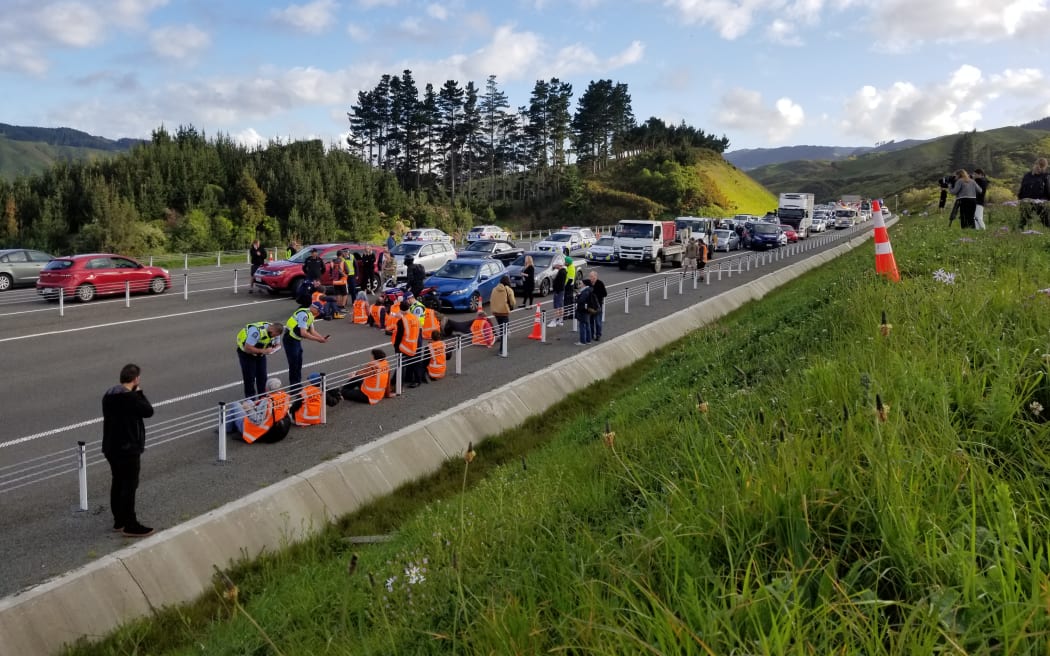 Protesters block traffic on Transmission Gully, Wellington, on 19 October 2022.
