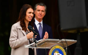 California Governor Gavin Newsom listens to New Zealand Prime Minister Jacinda Ardern speak during a news conference in San Francisco, California.